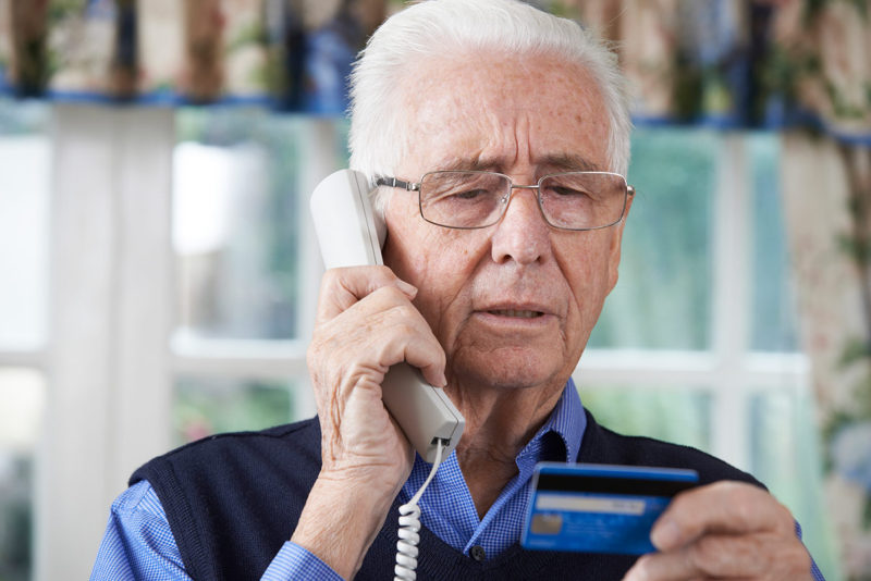elderly man during scam call