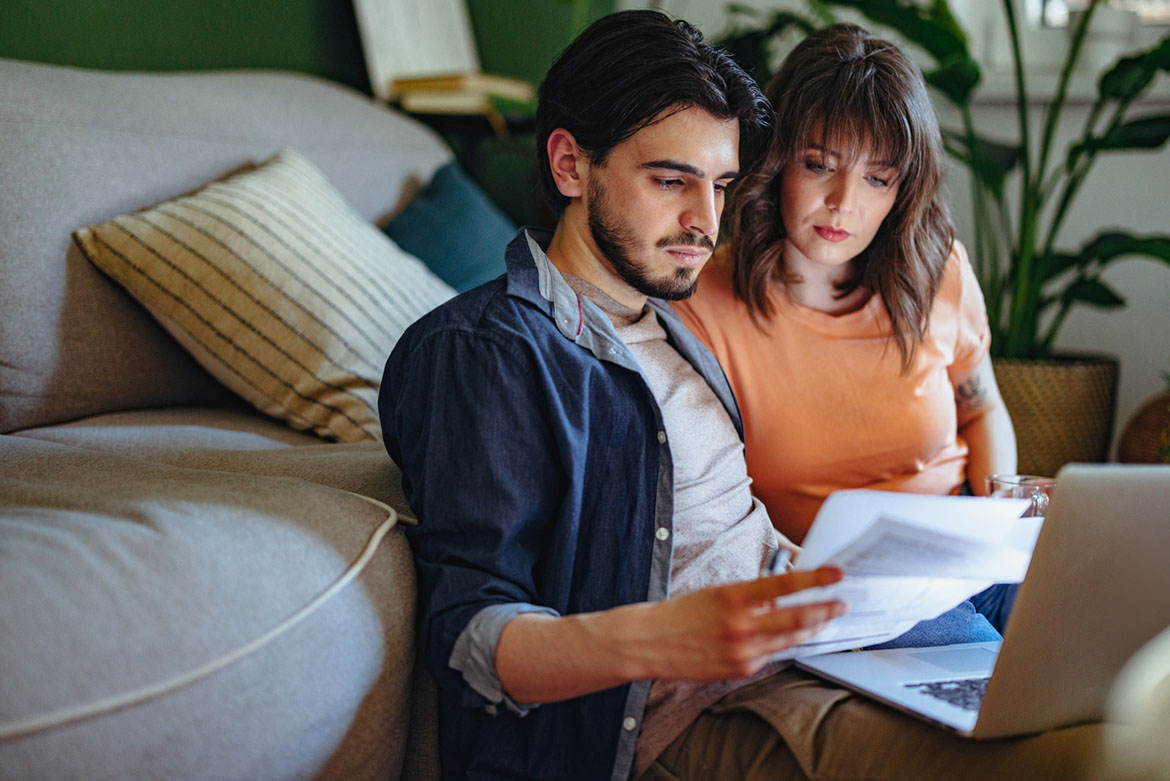 young couple reviewing bills